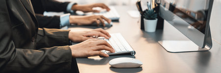Professional business people working on computer in corporate workplace. Office worker working in the office with modern technology and efficient work environment. Prodigyの写真素材