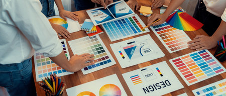 Graphic designer brainstorm logo and graphic art at busy creative studio workshop. Experiment and...