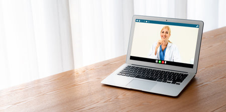 Doctor video call online by modish telemedicine software application for virtual meeting with patientの写真素材