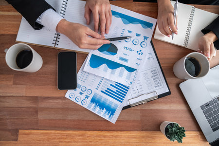 Busy analyst team in office discuss data analysis and marketing strategy using BI dashboard and...