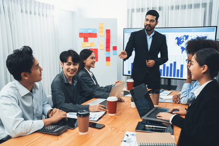 Businessman presenting data analysis dashboard display on TV screen in modern meeting for marketing strategy. Business presentation with group of business people in conference room. Concordの写真素材