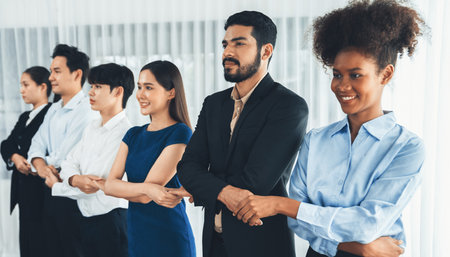Happy and smiling multiracial office worker hold hand in a line, promoting synergy and collaboration...