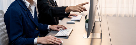 Professional business people working on computer in corporate workplace. Office worker working in the office with modern technology and efficient work environment. Prodigyの写真素材