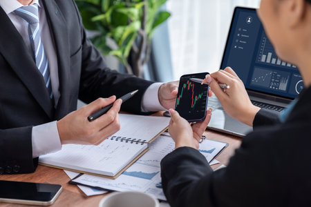 Risk management or financial team working and analyzing on clients portfolio while monitoring stock...