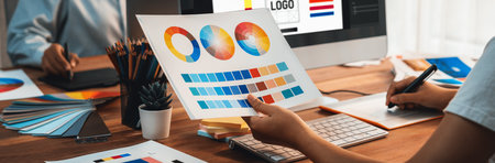 Graphic designer work on computer laptop and with graphic drawing pen while brainstorming unique...