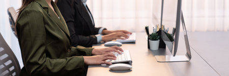 Professional business people working on computer in corporate workplace. Office worker working in the office with modern technology and efficient work environment. Prodigyの写真素材