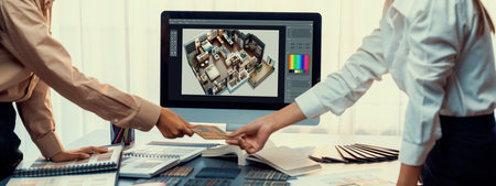 Group of interior architect designer team at table choosing various mood board samples with architecture software on laptop screen. Modern renovation and interior material selection concept. Insightの写真素材