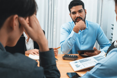 Multiracial analyst team use BI dashboard data to analyze financial report on meeting table. Group of diverse business people utilize data analysis by FIntech for business marketing decision. Concordの写真素材