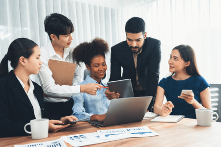 Multiracial analyst team use BI dashboard data to analyze financial report on meeting table. Group of diverse business people utilize data analysis by FIntech for success business marketing. Concordの写真素材