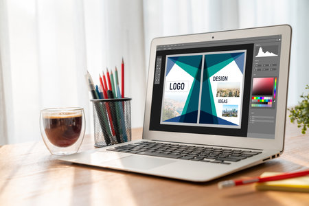 Graphic designer software for modern design of web page and commercial ads showing on the computer screenの写真素材