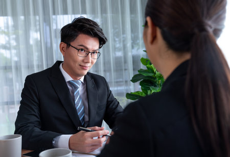 Busy analyst team in office discuss data analysis and marketing strategy using BI dashboard and statistics on laptop screen to improve business performance at meeting with strong teamwork. Jubilantの写真素材
