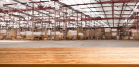 Empty table top with warehouse cordial background . Supply store and wooden pallet .の写真素材