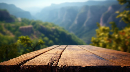 The empty wooden brown table top with blur background of trekking path. Exuberant image.の素材
