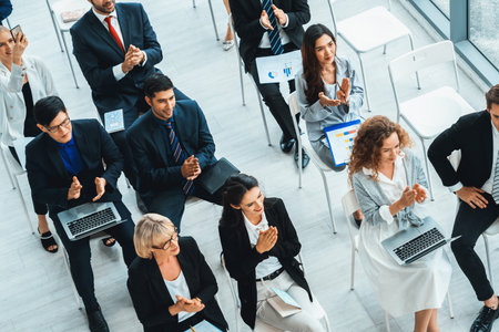Group of business people meeting in a seminar conference . Audience listening to instructor in employee education training session . Office worker community summit forum with expert speaker . Jivyの写真素材