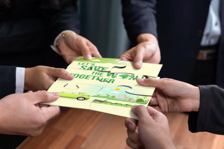 Cohesive group of business people forming jigsaw puzzle pieces in environmental awareness symbol as eco corporate responsibility for community and sustainable solution for greener Earth. Quaintの写真素材