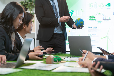 Businessman leader give presentation on eco-friendly implementation in order to reduce CO2 emission and make sustainable ecology for greener future with corporate environmental regulation. Quaintの写真素材