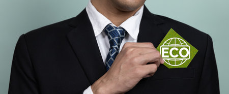 Eco-friendly corporate promoting sustainable and green business concept with businessman hold ECO symbol paper as environmental protection commitment using clean energy with zero CO2 emission. Alterの写真素材