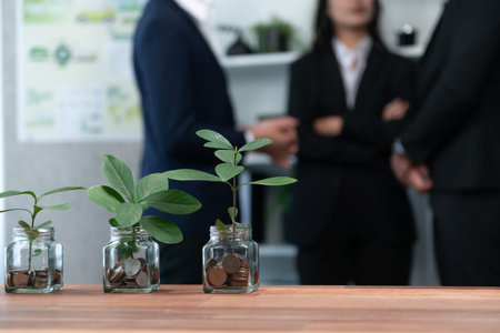 Organic money growth investment concept shown by money savings in glass jar. Financial investments rooted and cultivating wealth in harmony with nature. Quaintの写真素材