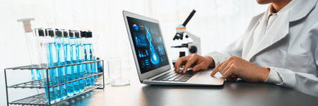 Scientist working on advance biotechnology computer software to study or analyze DNA data after...