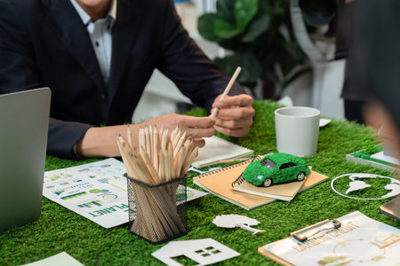 Diverse group of business people planning business marketing with environmental responsibility for greener ecology. Productive teamwork contribute natural preservation and sustainable future. Quaintの写真素材