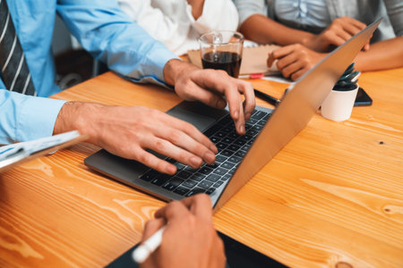Group of business people working together exchanging ideas and interactive teamwork concept in business meeting room. Team of business professional discussing new strategy and marketing. Meticulousの写真素材