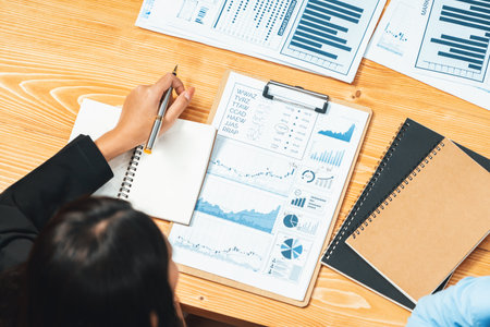 Top view diverse group of business analyst team analyzing financial data report paper on meeting...