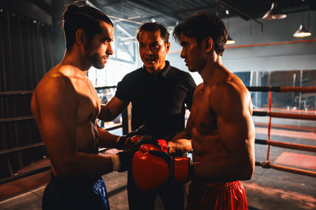 Referee explain rules and make preparation before give signal for the boxing match, Two Muay Thai boxer with strong muscular body on the ring ready to fight. Impetusの写真素材
