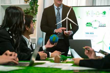 Businessman leader give presentation on eco-friendly implementation in order to reduce CO2 emission and make sustainable ecology for greener future with renewable alternative energy technology. Quaintの写真素材