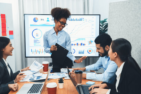 Young african businesswoman presenting data analysis dashboard on TV screen in modern meeting....
