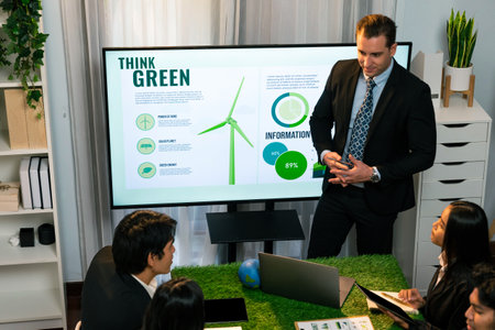 Businessman leader give presentation on eco-friendly implementation in order to reduce CO2 emission and make sustainable ecology for greener future with renewable alternative energy technology. Quaintの写真素材