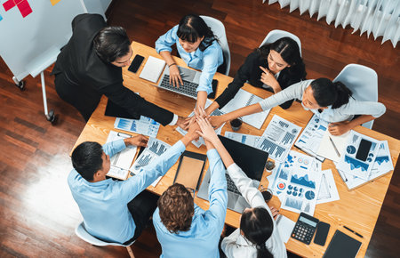 Multiracial business people make synergy hand stack together in meeting room as cooperation or team...