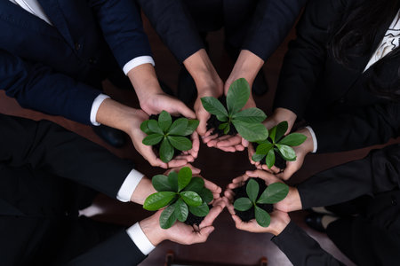 Panoramic banner top view business investment on reforestation by group of people holding plant together promoting CO2 reduction and natural preservation to save Earth with sustainable future. Quaintの写真素材