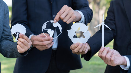 Business people holding eco alternative energy and recycle icon as CSR or corporate social responsibility as to utilize renewable and sustainable power technology for greener environment. Gyreの写真素材