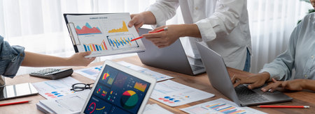 Panorama shot analyst team utilizing BI Fintech to analyze financial report with laptop....