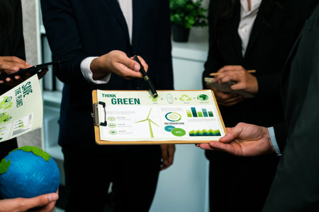 Diverse group of business people discussing for alternative energy utilization for greener sustainable Earth by reducing CO2 emission and carbon credit with renewable clean energy technology. Quaintの写真素材