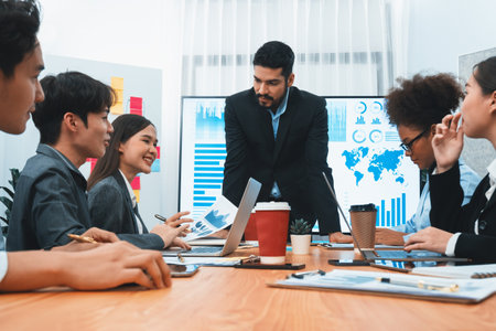 Businessman presenting data analysis dashboard display on TV screen in modern meeting for marketing strategy. Business presentation with group of business people in conference room. Concordの写真素材