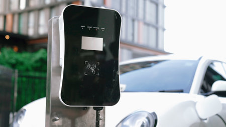 Progressive innovation urban electric on-street charging station with electric vehicle battery being...