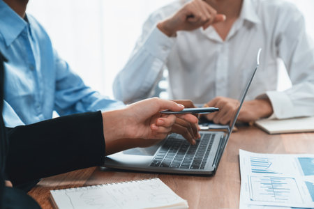 Multiracial analyst team use BI dashboard data to analyze financial report on meeting table. Group of diverse business people utilize data analysis by FIntech for success business marketing. Concordの写真素材