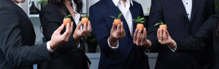 Sustainable eco-friendly business investment on forest regeneration by group of business people holding plant together in office promoting CO2 reduction and natural preservation. Panoramic view.Quaintの写真素材
