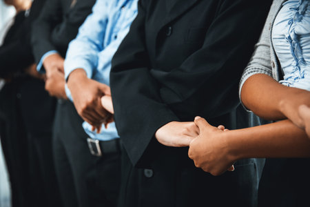 Modern diversity and multicultural company, business people joining hand together and standing in line, shared commitment to collaboration and cooperation concept background. Meticulousの写真素材