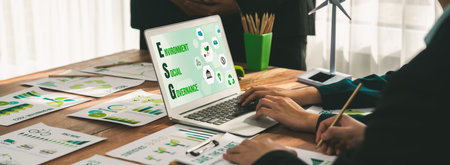 ESG environmental social governance display on laptop on eco-friendly company meeting with business people implementing environmental protection for clean and sustainable future ecology. Trailblazingの写真素材