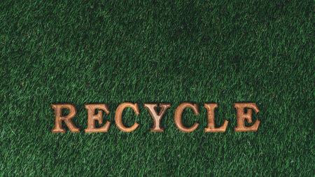 Environmental awareness campaign showcase arranged recycle message in on biophilic green grass background. Environmental social governance concept idea for sustainable and greener future. Gyreの写真素材