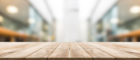 The empty wooden table top with blur background of an office and city. Exuberant image.の写真素材