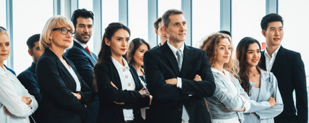 Successful business people standing together showing strong relationship of worker community. A team...
