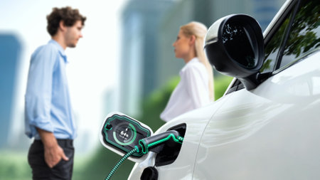 Business people waiting after recharge electric car from charging station display smart battery...