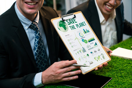 Diverse group of business people planning business marketing with environmental responsibility for greener ecology. Productive teamwork contribute natural preservation and sustainable future. Quaintの写真素材