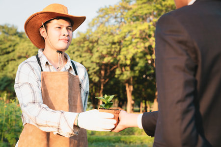 Eco-business company empower farmer with eco-friendly farming practice and clean agricultural technology. Cultivate sustainable future nurturing plants to grow and thrive. Gyreの写真素材