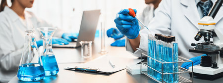 Group of dedicated scientist conduct chemical experiments and research in medical lab as groundbreaking developing for vaccine drug or antibiotic. Pharmaceutical and biochemistry laboratory. Neotericの写真素材