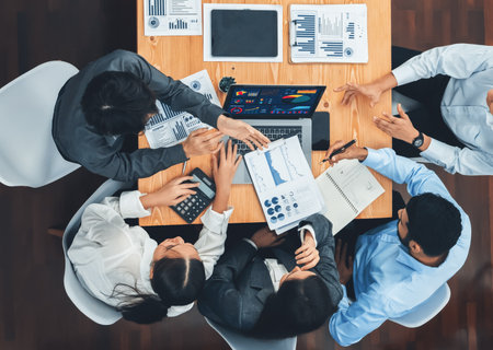 Top view multiracial analyst team use BI dashboard display on laptop screen, analyzing financial data for strategic decision. Fintech analyzes marketing indicators. Concordの写真素材