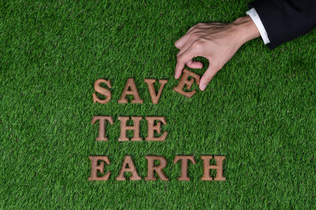 Eco awareness campaign for Earth day concept showcase message arranged in Save Earth on biophilic green background. Environmental social governance concept idea for sustainable and greener future.Gyreの写真素材